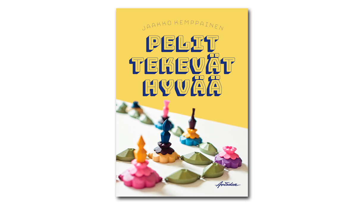 Kirjan kansi. Teksti "Jaakko Kemppainen" ja "Pelit tekevät hyvää". Kansikuvassa korumaisia pelinappuloita.