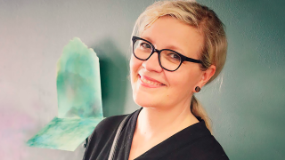 Kasvokuva Mollu Heinosta.